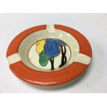 A Clarice Cliff ash tray decorated in the autumn p