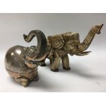 A silver plated elephant box and a carved bone elephant