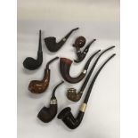 Eight various old wooden smoker's pipes.