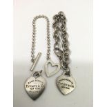 Two Tiffany silver bracelets and a heart charm