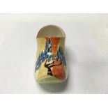 A Clarice Cliff clog decorated in the windbells pa