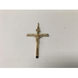 A gold pendant in the form of a crucifix 3 grams approx