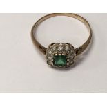A 9 ct gold ring inset with emerald and diamonds