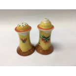 A pair of Clarice Cliff cruets decorated in the na