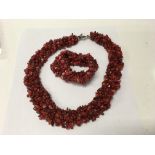 A red stone necklaces and matching bracelet