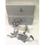 A pair of large Lladro boy and girl clowns, boxed.