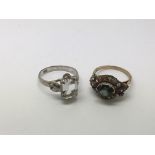 Two 18ct gold rings set with semi precious stones,