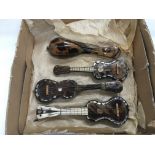 Four old tortoiseshell miniature models of mandoli