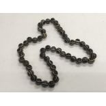 A necklace of agate prayer beads.