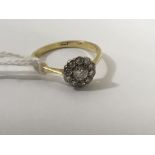 An 18ct gold and diamond cluster ring.Approx size