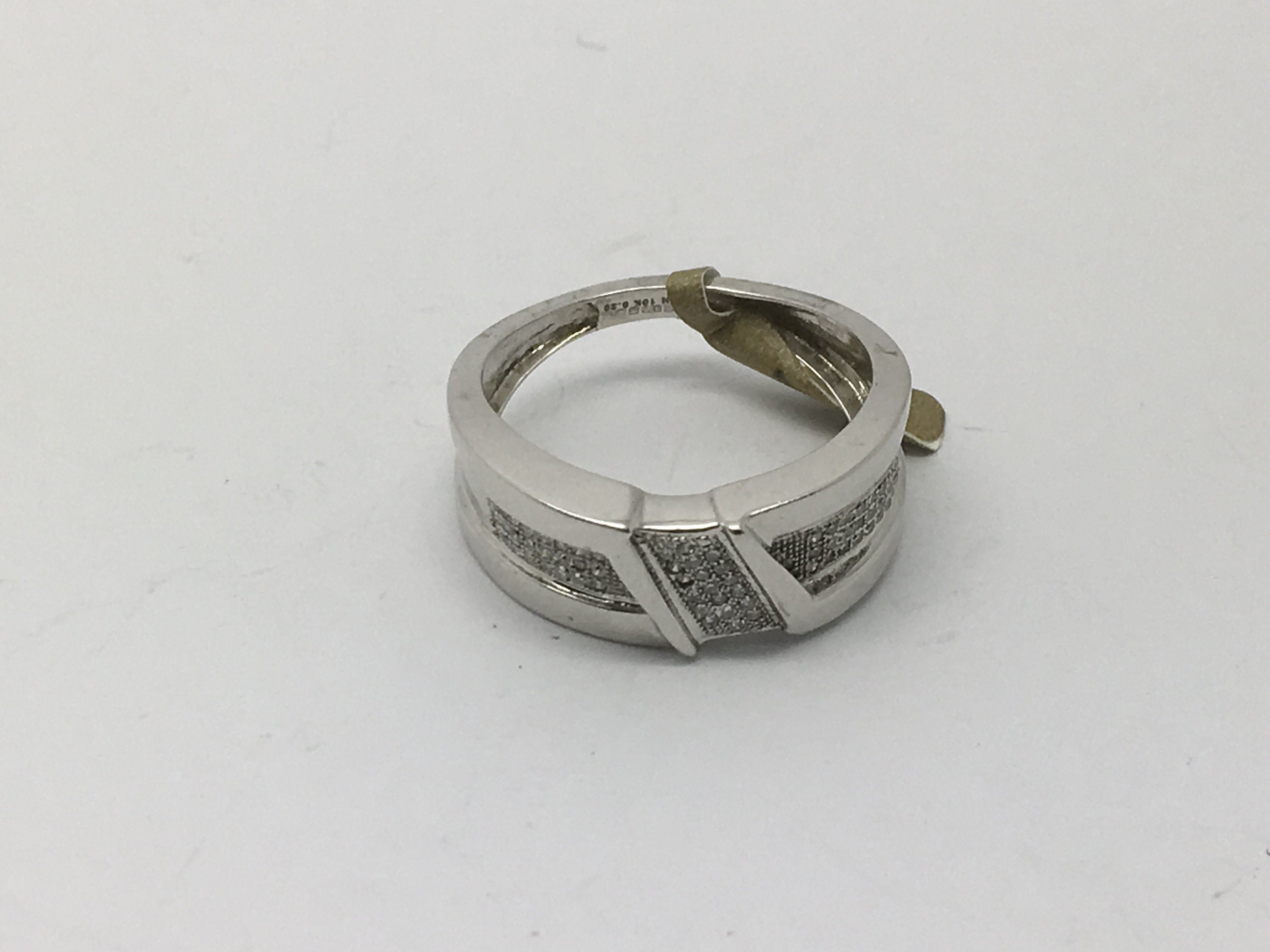 An unusual white gold diamond set band ring, appro