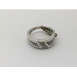 An unusual white gold diamond set band ring, appro