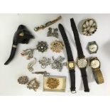 A small group of vintage brooches and watches plus