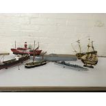 A box containing an assortment of model ships to i