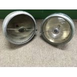 A pair vintage Jaguar car sports headlights, one l