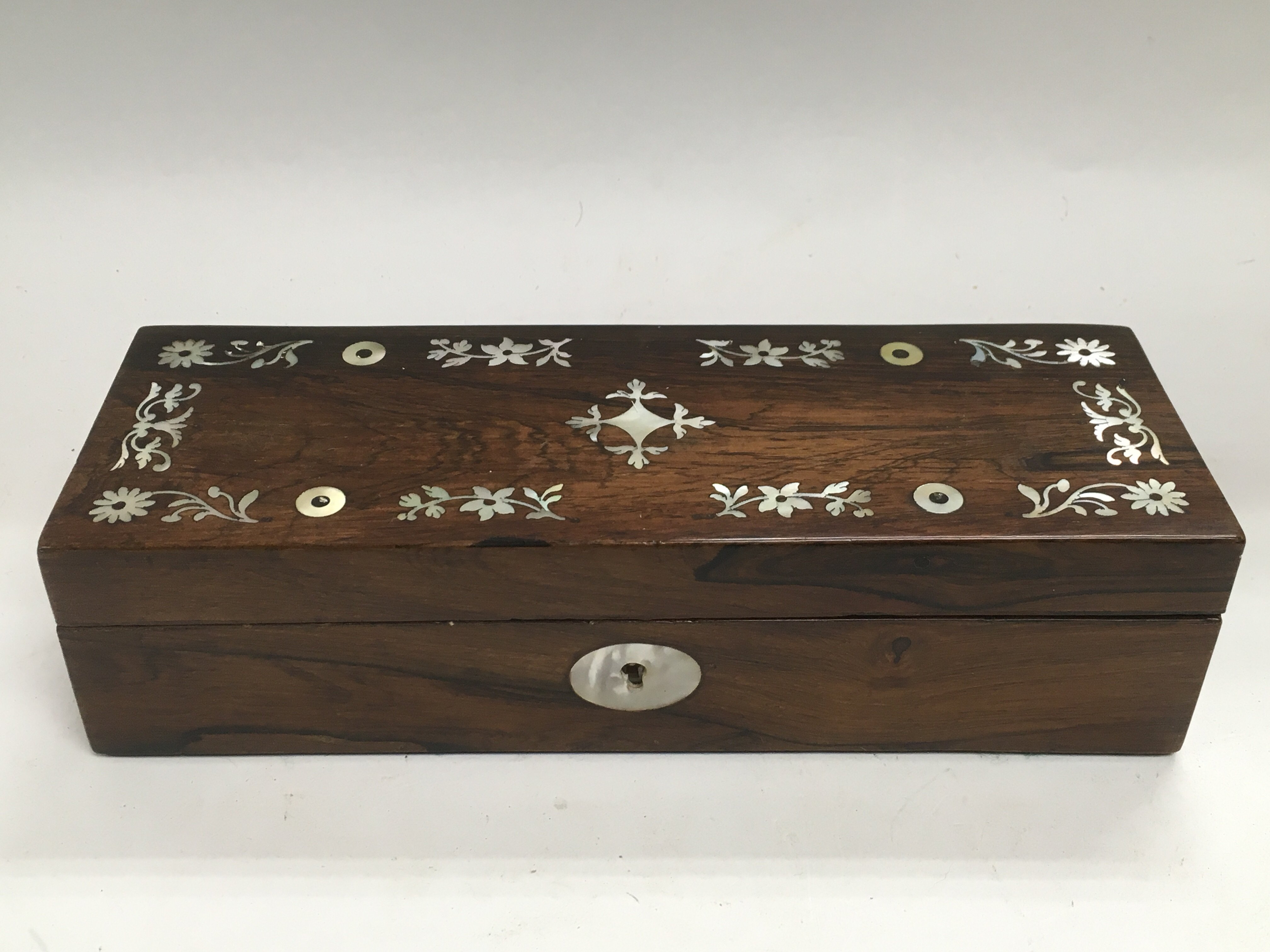 A rosewood box inlaid with mother of pearl and wit