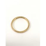 A 22ct gold wedding band.Approx 4g