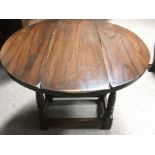 A small, twin flap top table.Approx 59x50cm high