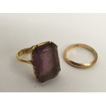 A 22ct gold ring set with a square amethyst colour stone plus a 22ct gold wedding ring.Approx 7.22g,