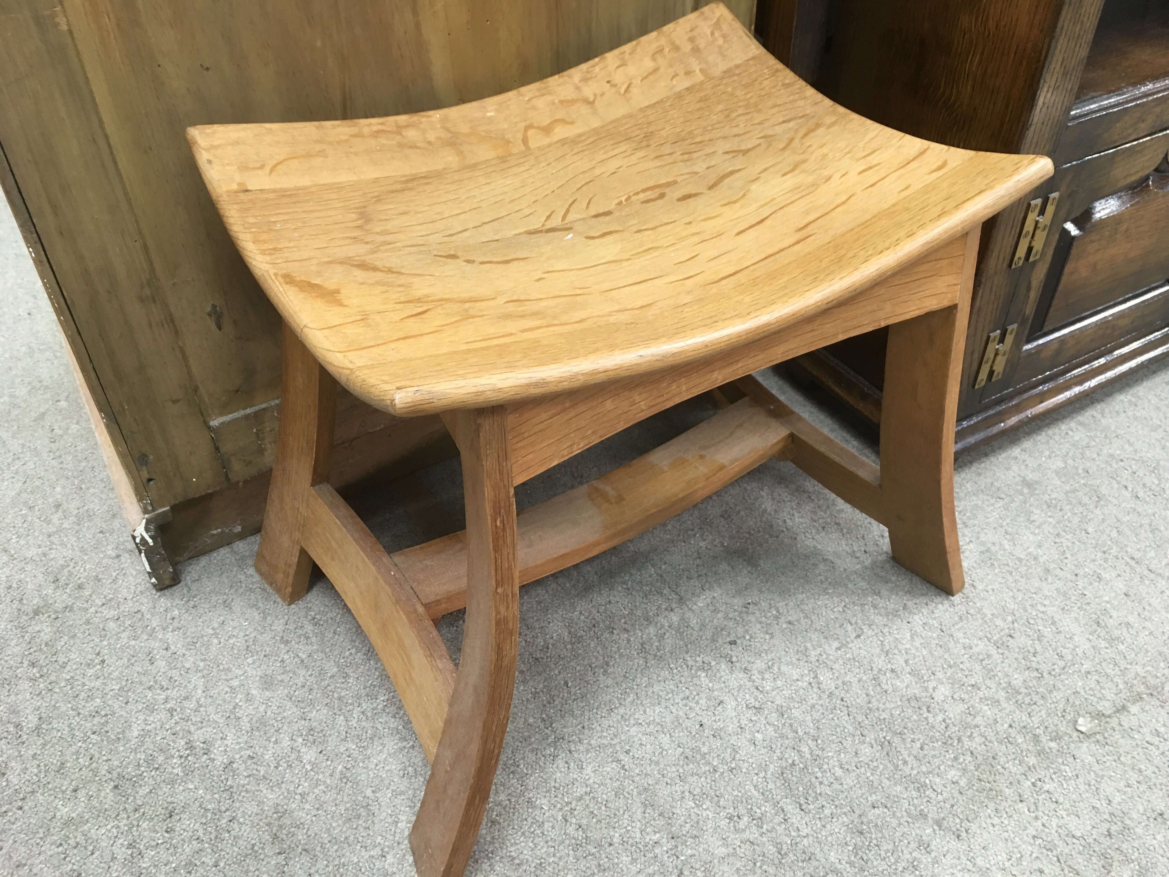 An unusual Japanese style oak stool, approx 36cm x 55cm x 44cm.