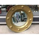 A circular brass framed mirror, approx diameter 50