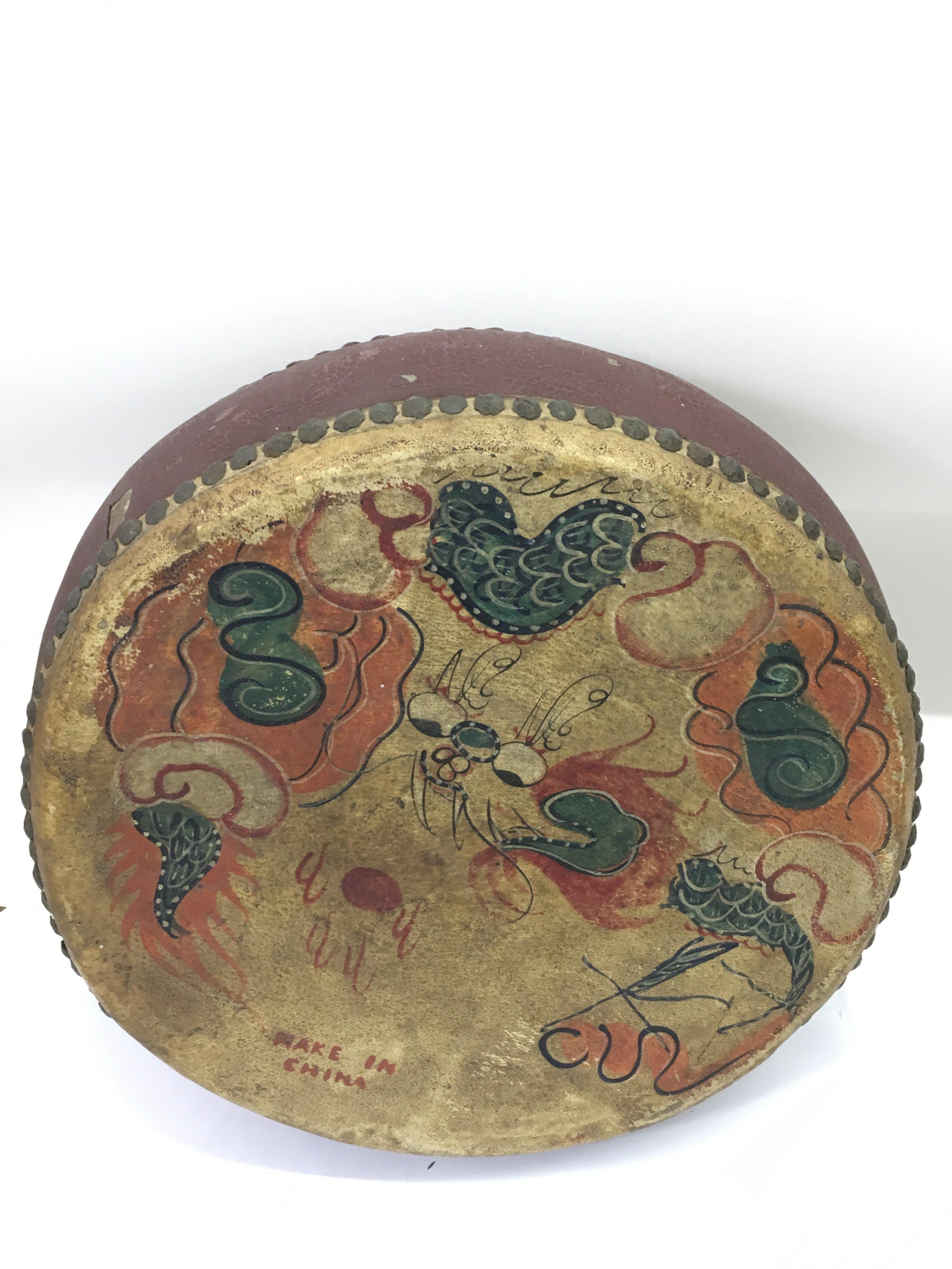 A wooden and painted hide Chinese drum, approx 34c