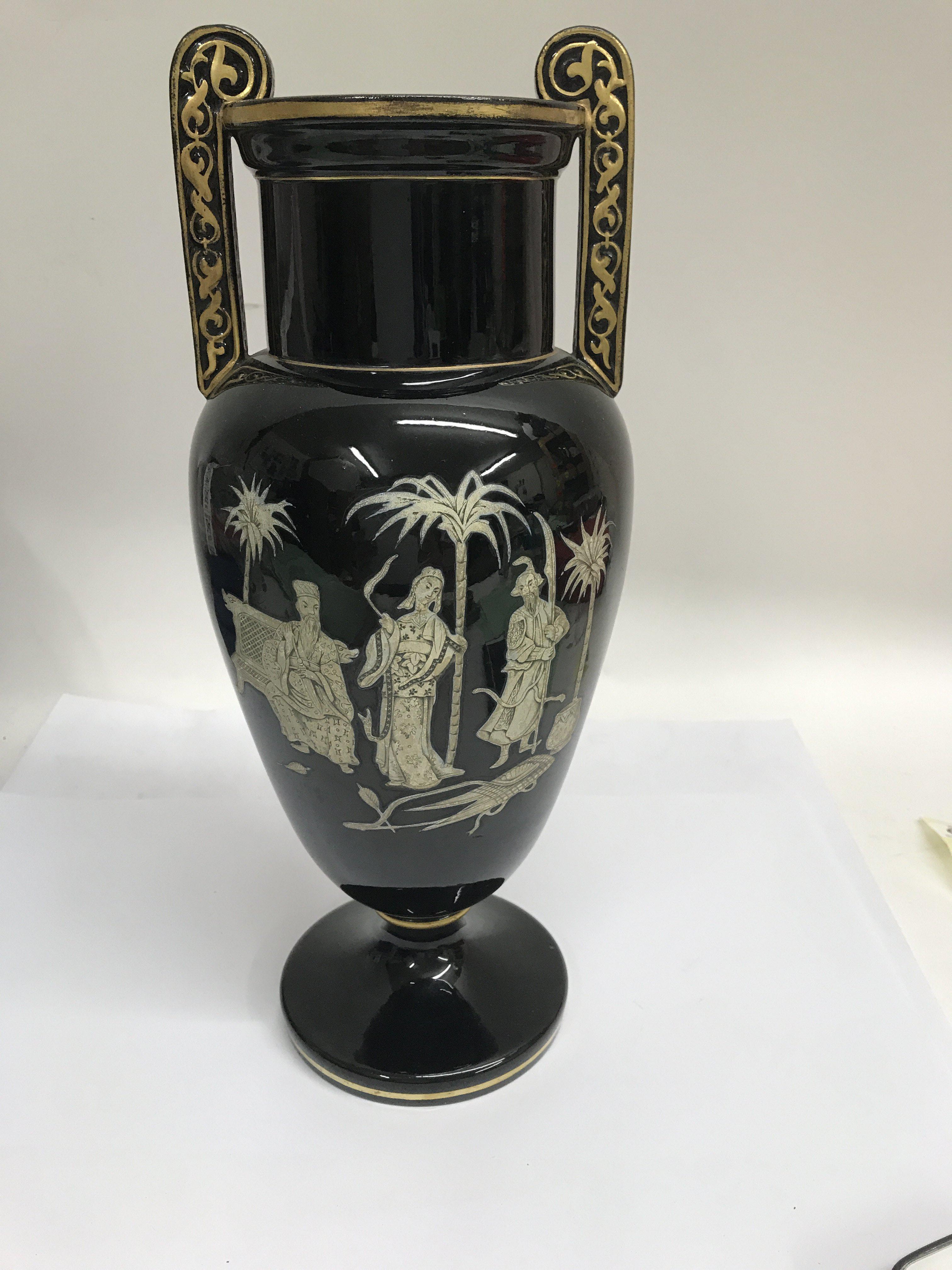 A Victorian acid etched glass vase decorated with