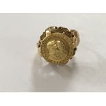 A unmarked gold ring inset with gold ring size M