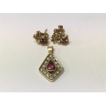 A pair of 18 ct earrings inset with diamonds and rubies and a unmarked pendant