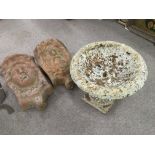 Two wall hanging terracotta garden ornaments, approx 44cm and 42cm, plus a small stone bird bath (