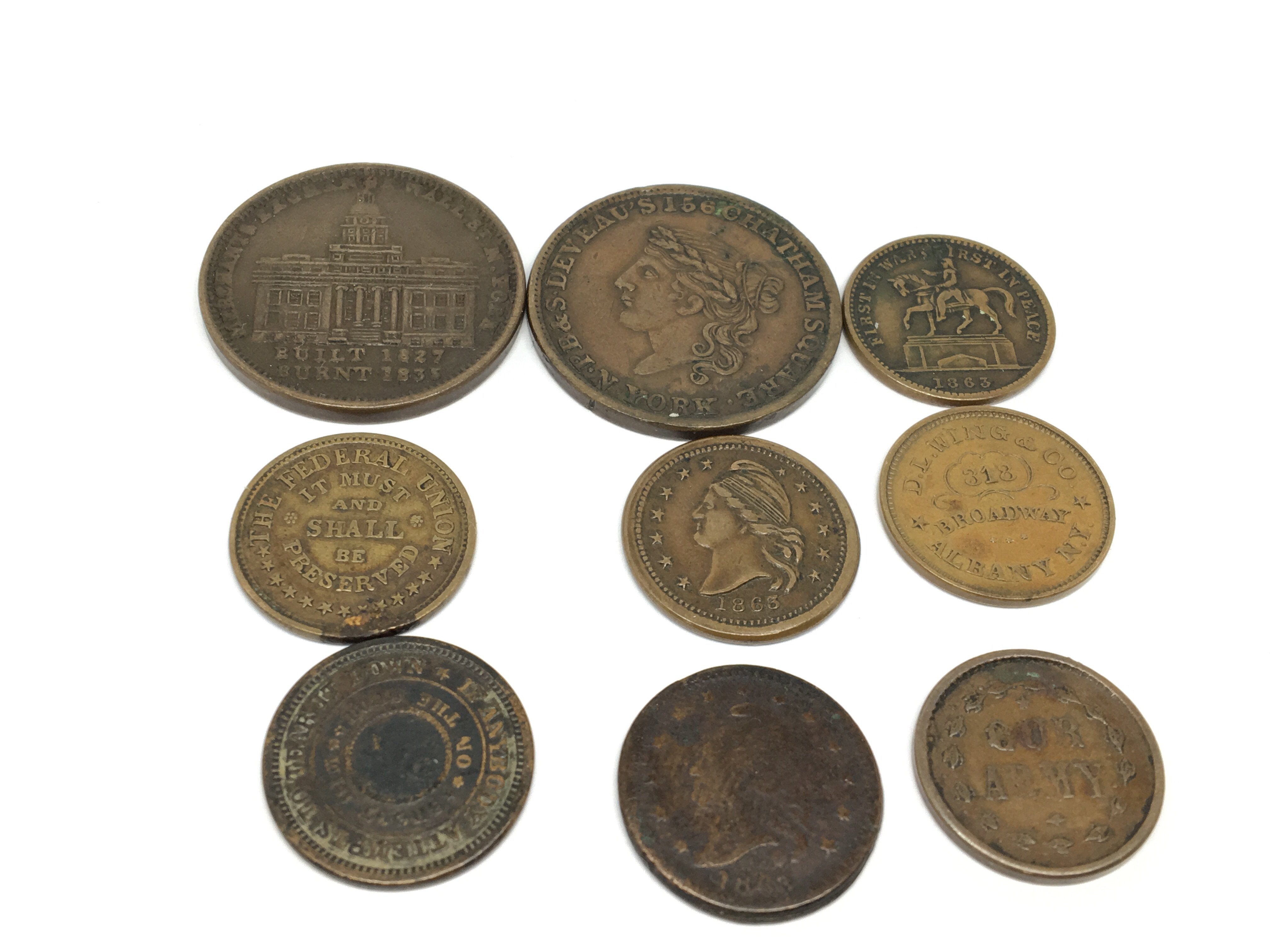 A collection of American Cival war token coins, co