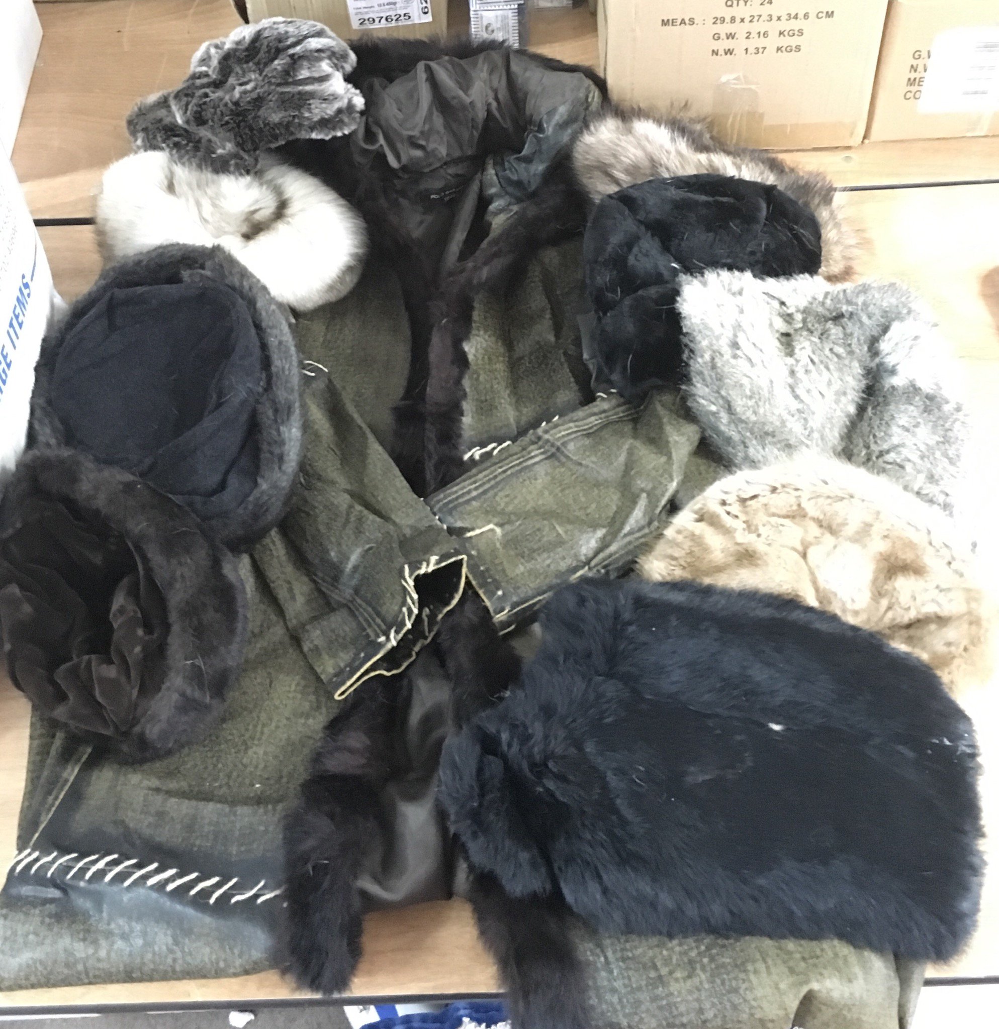 A leather and fur lined coat plus fur hats