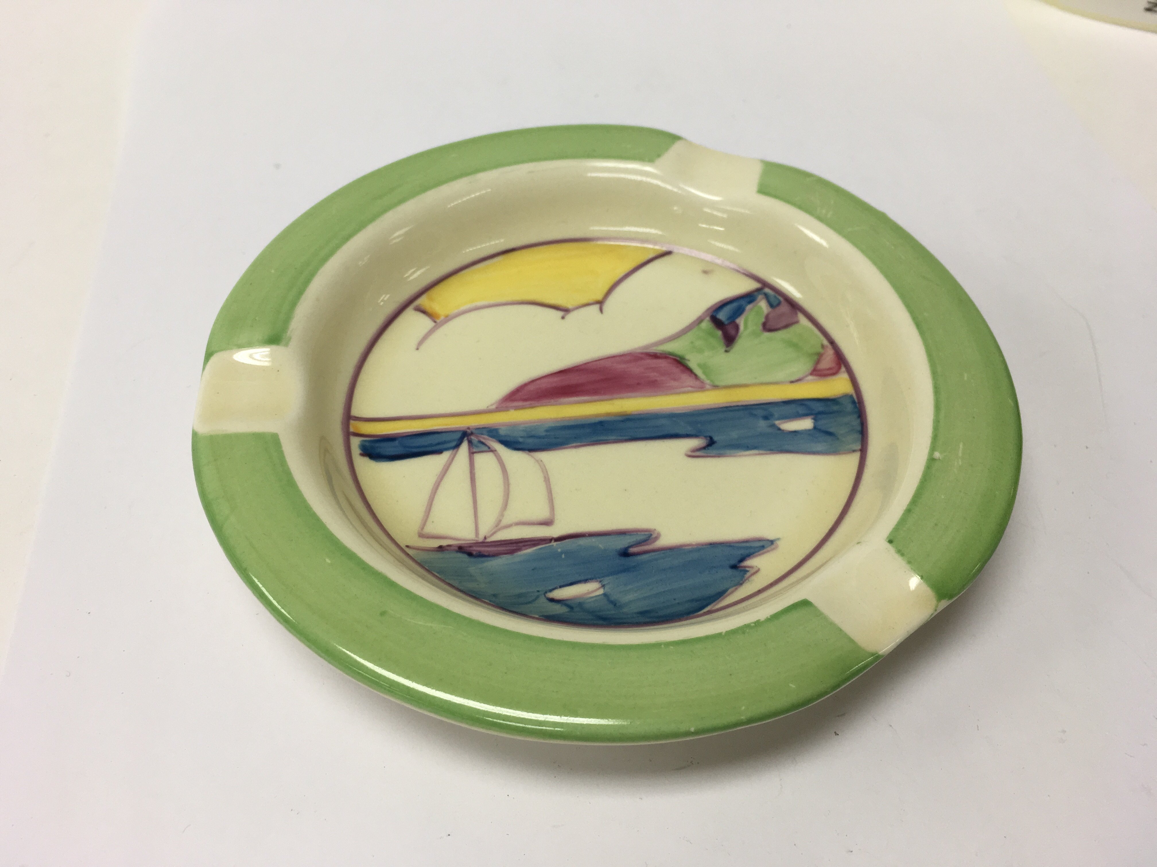 A Clarice Cliff ash tray decorated in the Gibralta