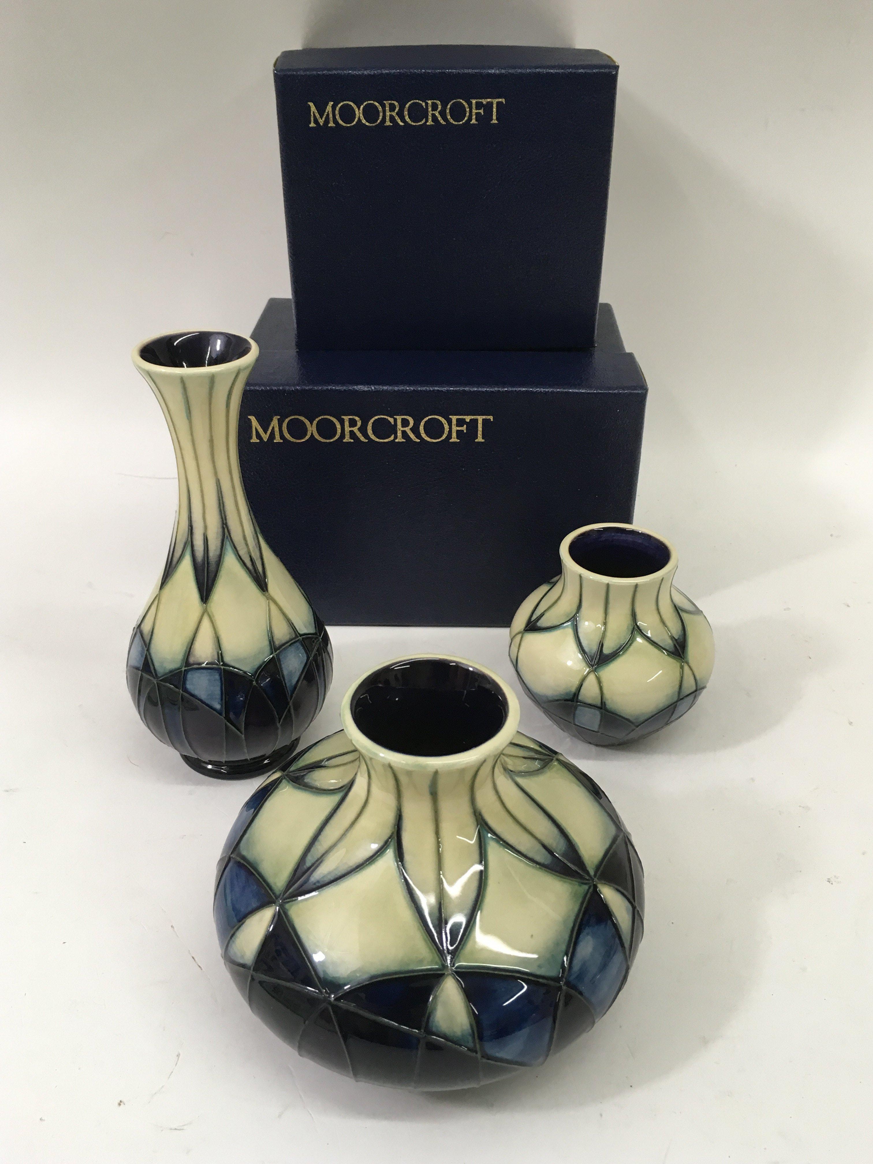 Three small Moorcroft vases wth cream and mauve ha