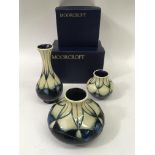 Three small Moorcroft vases wth cream and mauve ha