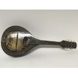 A Russian Mandolin type instrument with eight stri