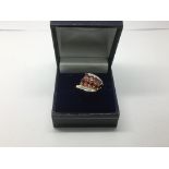 A 9ct gold, ruby and diamond ring, approx 2.6g and