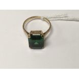 A 9 ct gold ring inset with green stone