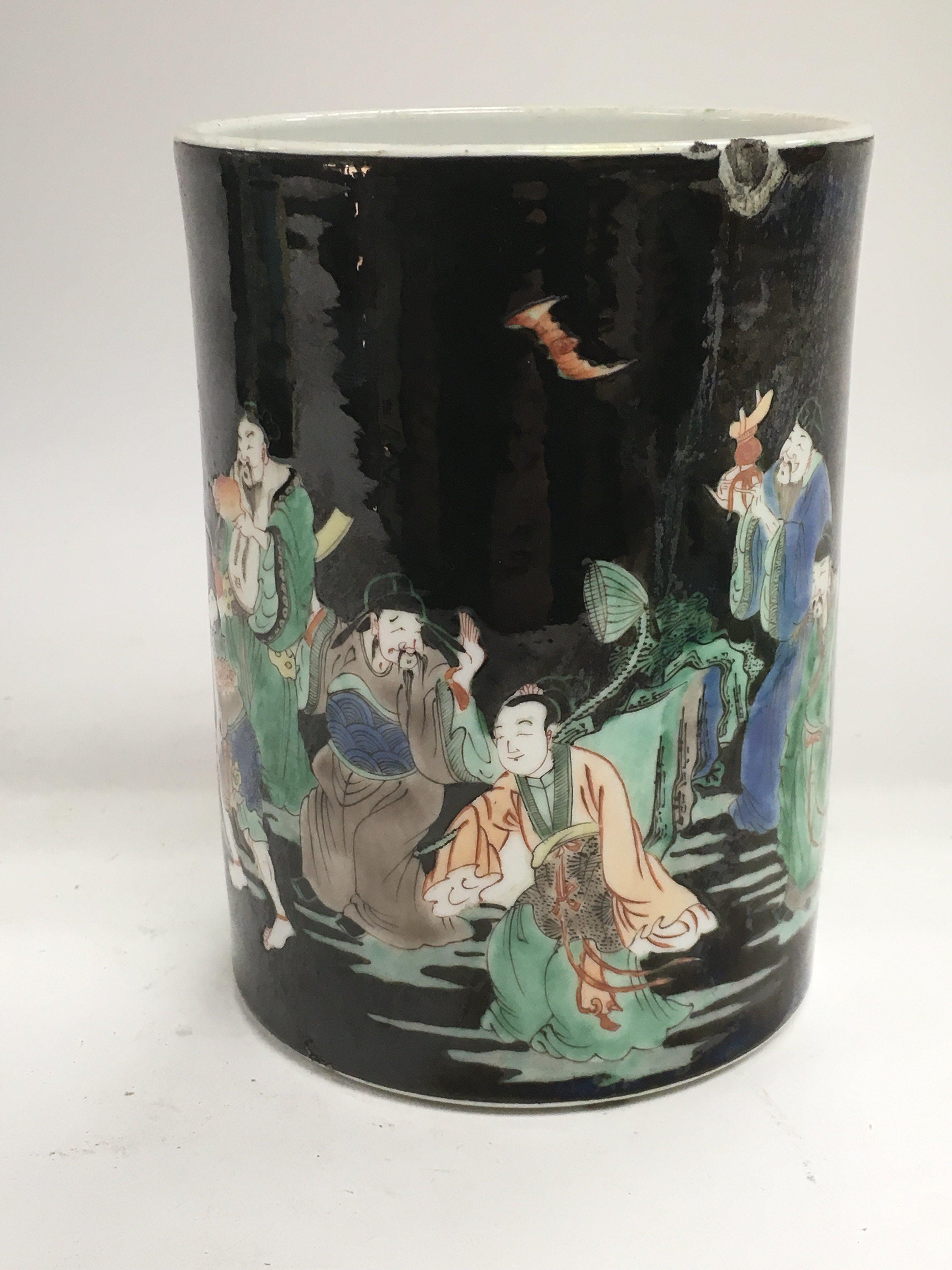 A famille vert brush pot decorated with various fi