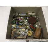 A box of odds comprising coins, military badges et