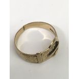 A gent's 9ct gold buckle ring.Approx T, 3.4g