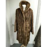 A vintage full length brown fur coat with stripe effect.Approx size 14
