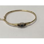 A 9 ct gold bracelet inset with sapphire and diamo
