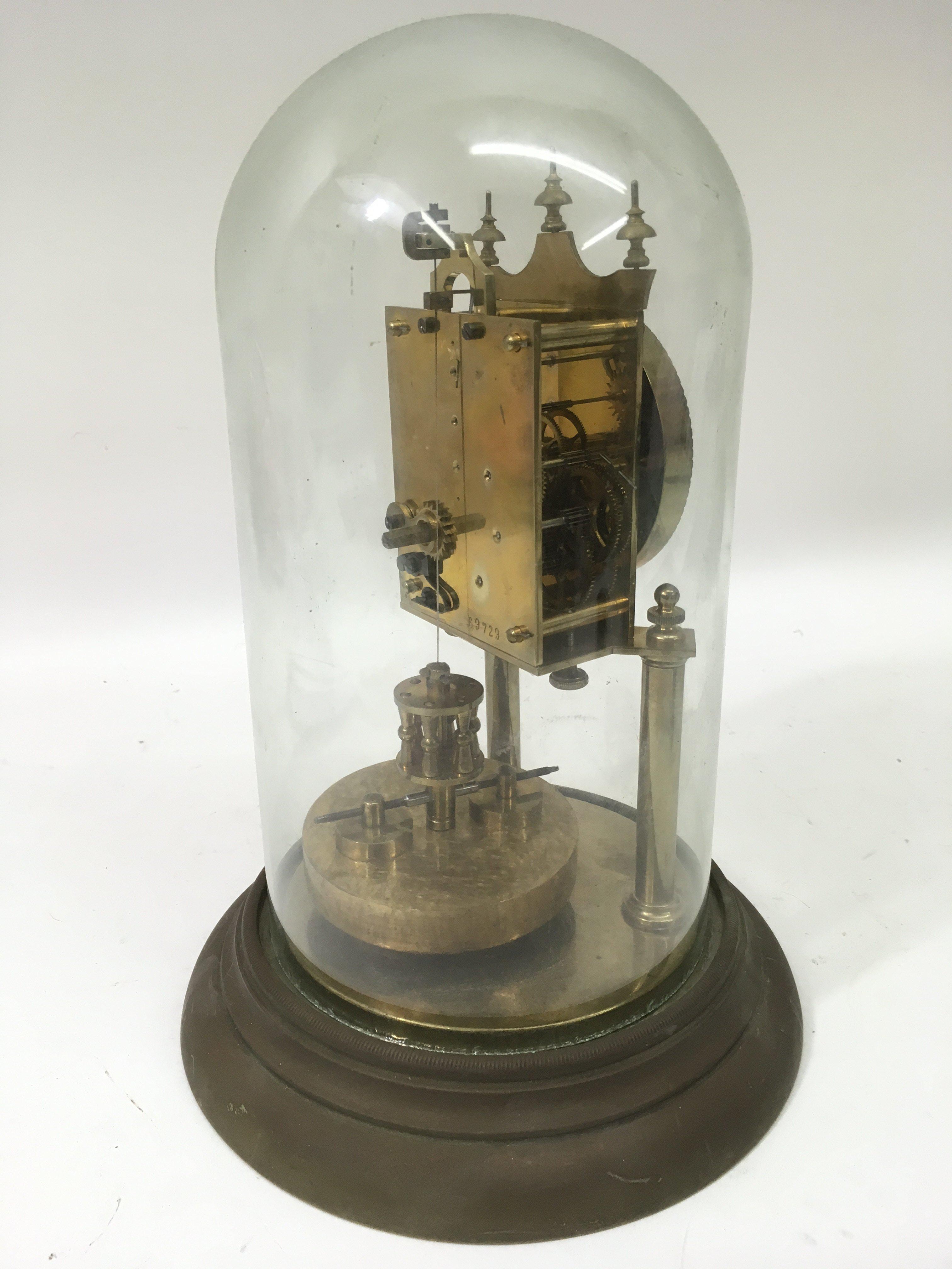 A brass skeleton clock under glass dome.Approx 30c - Image 2 of 2