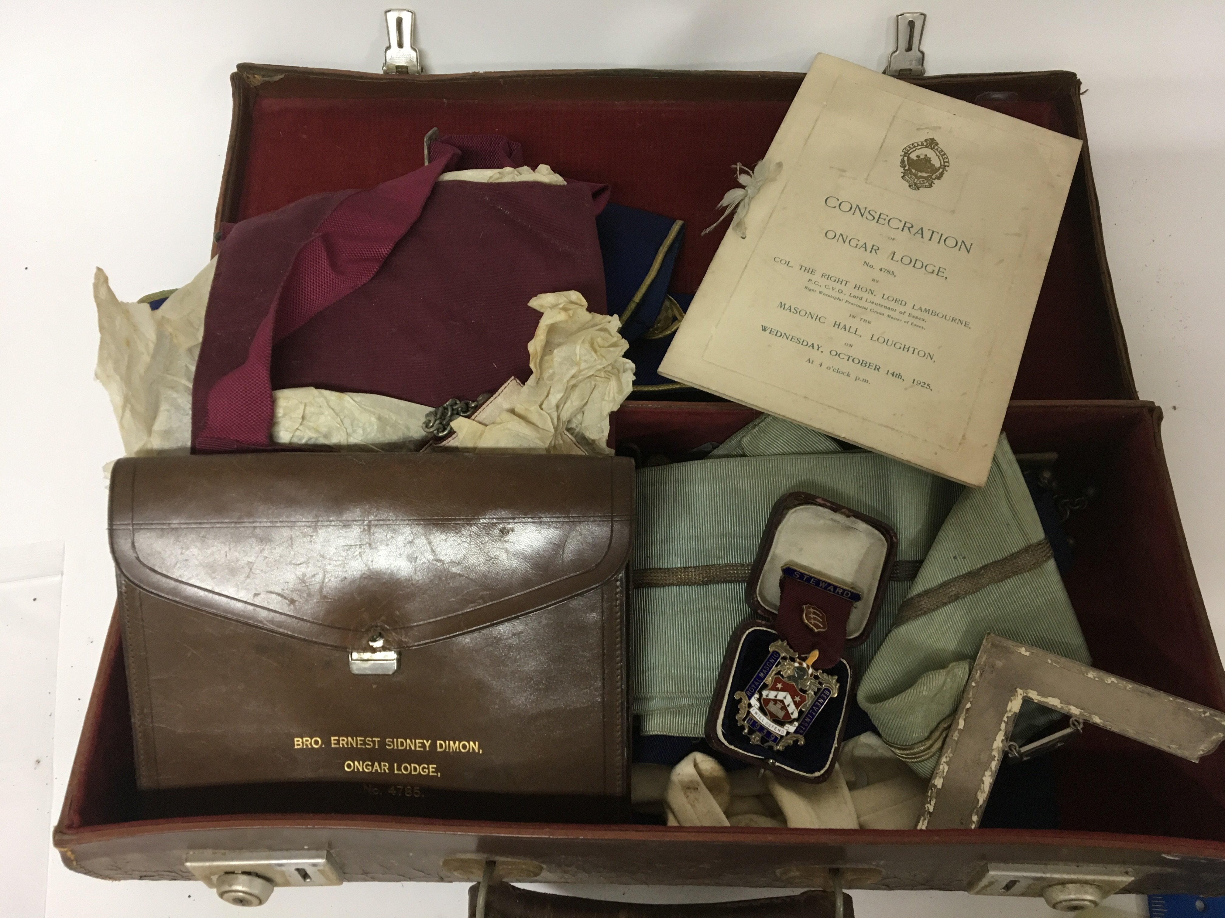 A case containing Masonic regalia. Including a sil