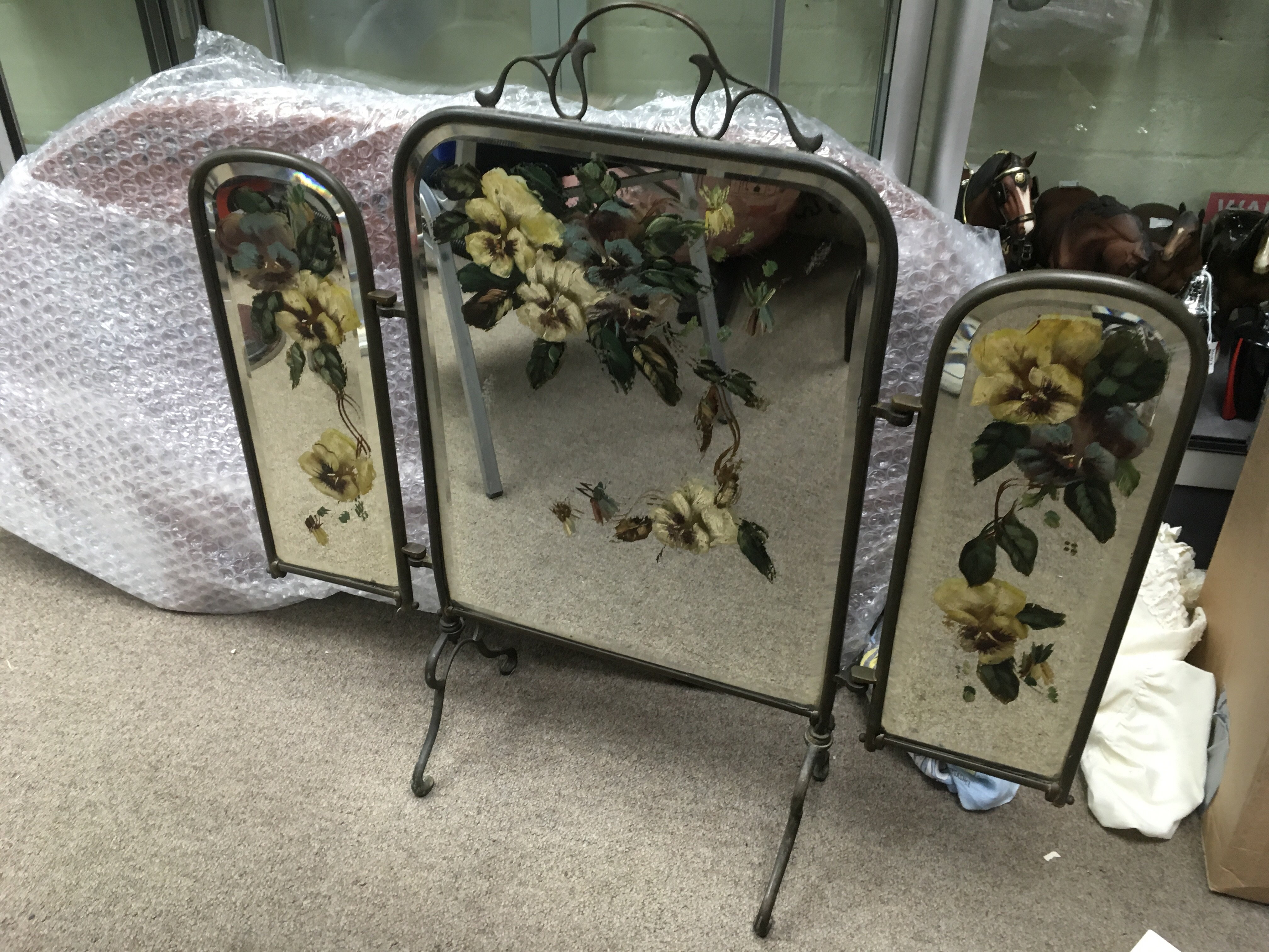 A Victorian brass firescreen with painted mirror p