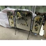 A Victorian brass firescreen with painted mirror p