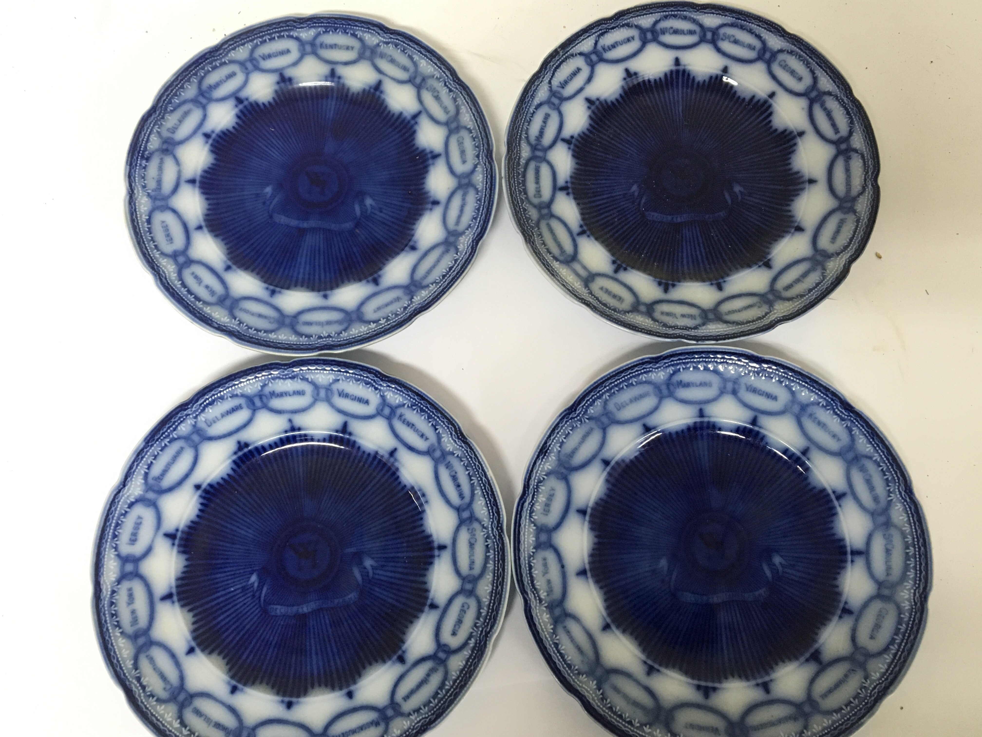 A set of four rare Victorian flow blue plates the