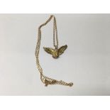 A 9 ct gold pendant in the form of a eagle on atta