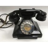 A circa 1930s bakelite telephone.